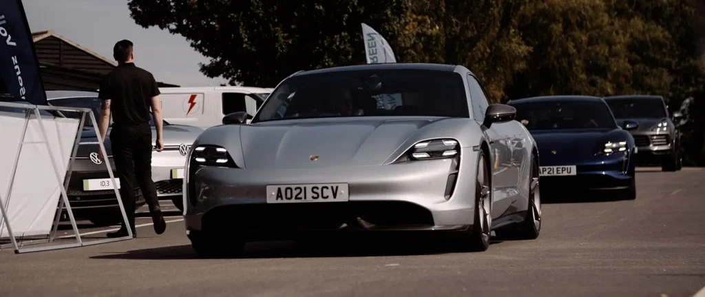 Still from the Driving Business Green event video showing a Porsche Taycan electric vehicle.