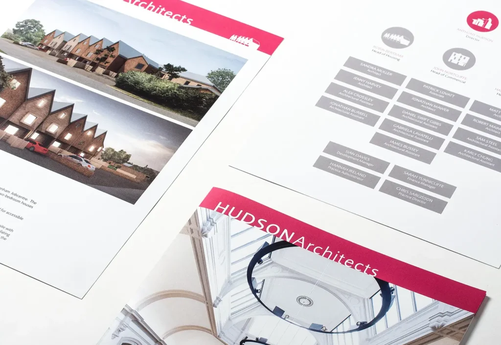 Photograph of the internal booklets of the Hudson Architects brochure showing the team page, the front cover of the sectors booklet and a project page.