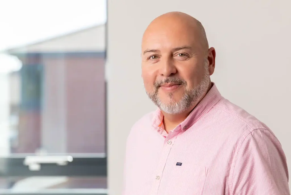 Commercial profile picture of a senior leader at Credo Asset Finance, showing a business person positioned near a window.