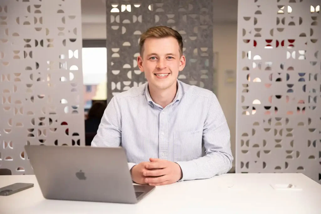 Professional profile picture of a business development manager at a commercial office.