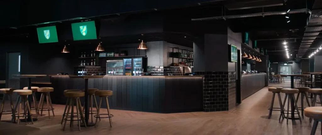 Still frame of the Universal Carpentry construction project video, showing the completed Lion and Castle bar at Norwich City Football Club.