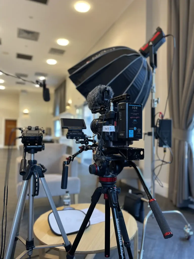 Behind the scenes of filming an event video for a business. Featuring high quality camera and lighting equipment.