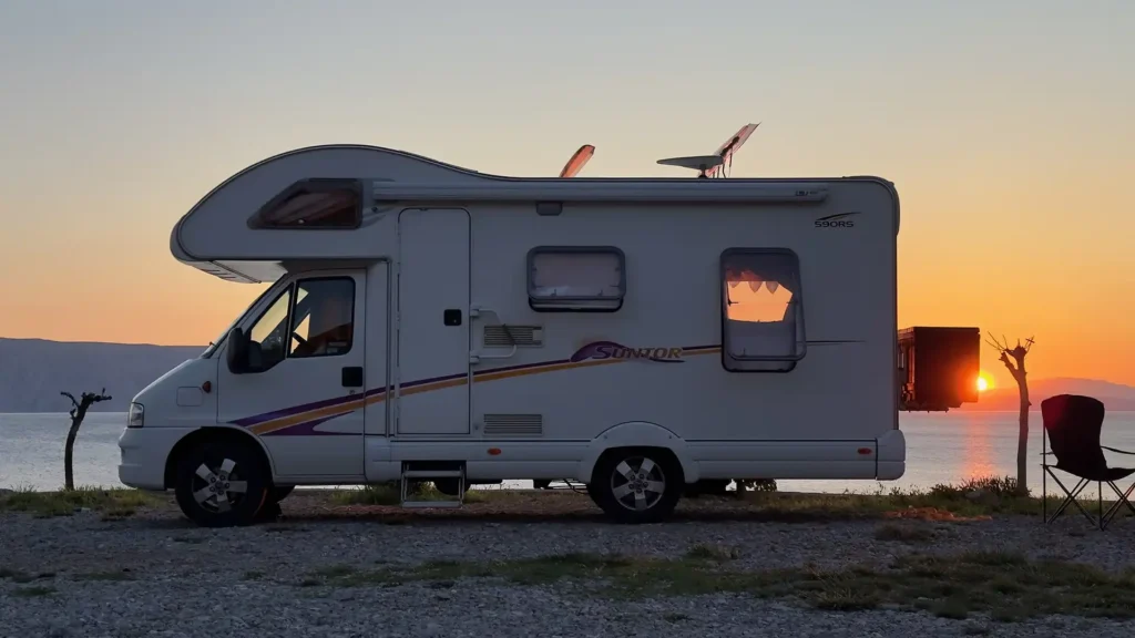 Photograph of our motorhome taken at sunset on the coast in Croatia. The journey was the starting point for MADE BY WOODSMOKE: Stories from the Road
