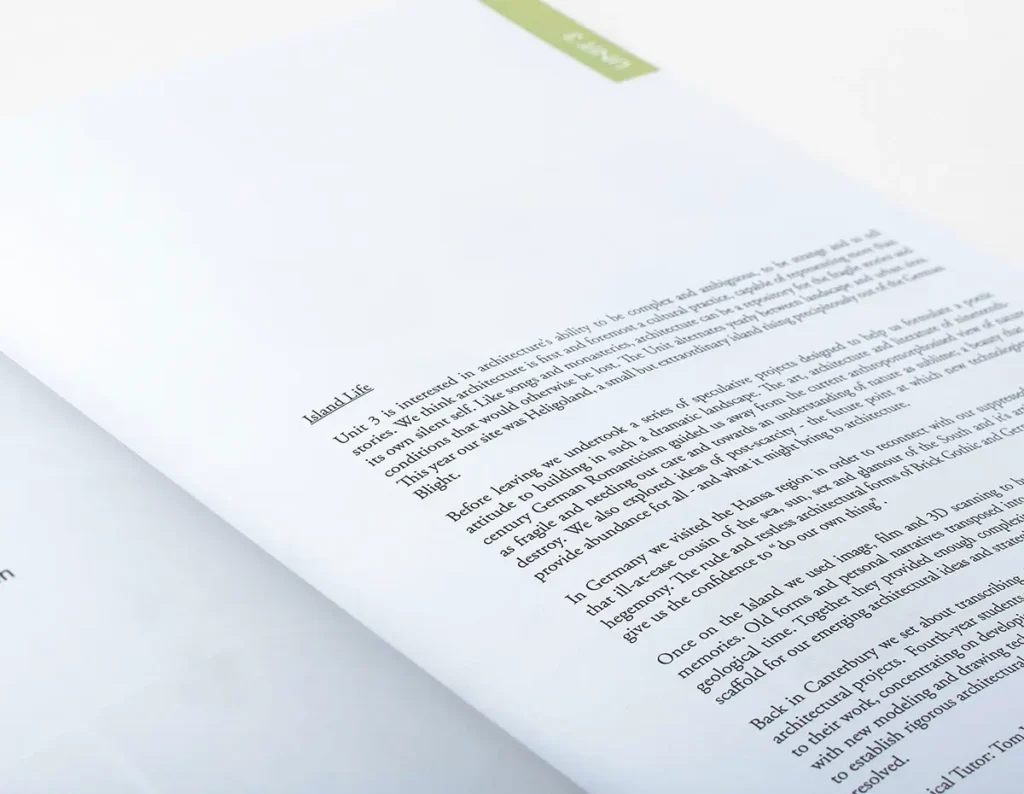 Photograph of the inside of the Kent School of Architecture catalogue, showing the text of a project description.